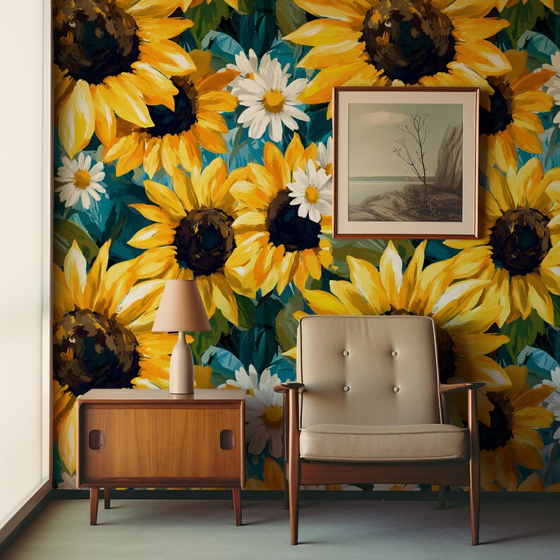 May include: A room with a sunflower and daisy floral wallpaper. A framed landscape painting hangs on the wall. A wooden side table with a lamp and a mid-century modern armchair complete the decor.