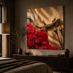 May include: A striking wall art print showcasing a vivid red rose and a lizard against a textured backdrop. The artwork is mounted on a clear panel, offering a contemporary look. The image is set in a bedroom with a warm, inviting atmosphere.