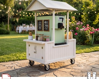 May include: A white mobile vending cart with a gabled roof, featuring a light green soft-serve ice cream machine, two framed chalkboard signs, glass jars, and paper cups. The cart has four caster wheels and a cabinet with two doors.