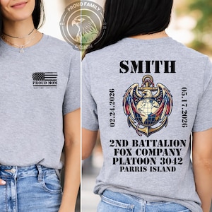 May include: A heather gray t-shirt with the text "PROUD MOM" and an American flag graphic on the front. The back of the shirt features the name "SMITH", an anchor graphic, and text that reads "2ND BATTALION FOX COMPANY PLATOON 3042 PARRIS ISLAND".