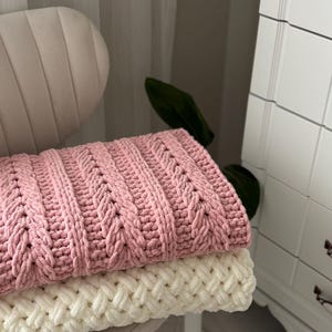 May include: A set of three ceramic mugs with a speckled, matte finish. The mugs are in shades of cream, light gray, and dark gray. Each mug has a simple, minimalist design, perfect for coffee or tea.