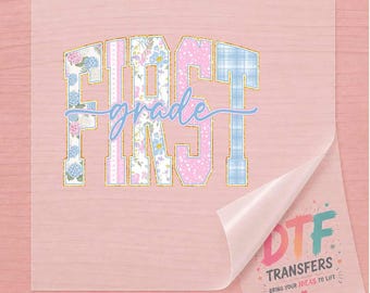 May include: A clear DTF transfer sheet featuring the word FIRST in block letters with floral, polka dot, and plaid patterns in blue, pink, and white, with the word grade in blue script. A corner is peeled back to reveal a logo with DTF TRANSFERS text.