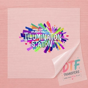May include: A clear DTF transfer sheet featuring a vibrant, multi-colored graphic with the text SHINING A LIGHT ON WHO JESUS REALLY IS ILLUMINATION STATION JOHN 8:12. The bottom corner shows the text DTF TRANSFERS BRING YOUR IDEAS TO LIFE.