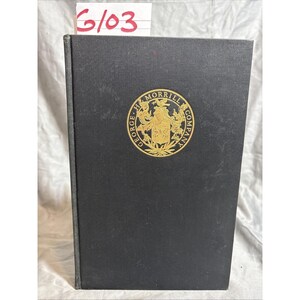 Peut inclure: Un livre à couverture rigide noire orné d'un emblème doré. L'emblème circulaire porte l'inscription "GEORGE H. MORRILL COMPANY". La tranche du livre est visible, et une étiquette blanche avec le numéro "6103" en rouge est en haut.