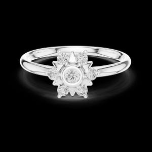 May include: A silver ring with a floral design. The ring features a central, round diamond surrounded by smaller diamonds, creating a flower-like shape. The band is smooth and polished, and the ring is set against a black background.