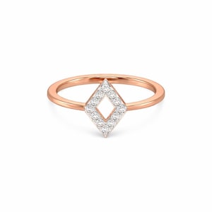 May include: Rose gold ring featuring a diamond-shaped design. The center of the ring is a diamond-shaped cluster of small, sparkling stones. The band is a thin, polished rose gold.
