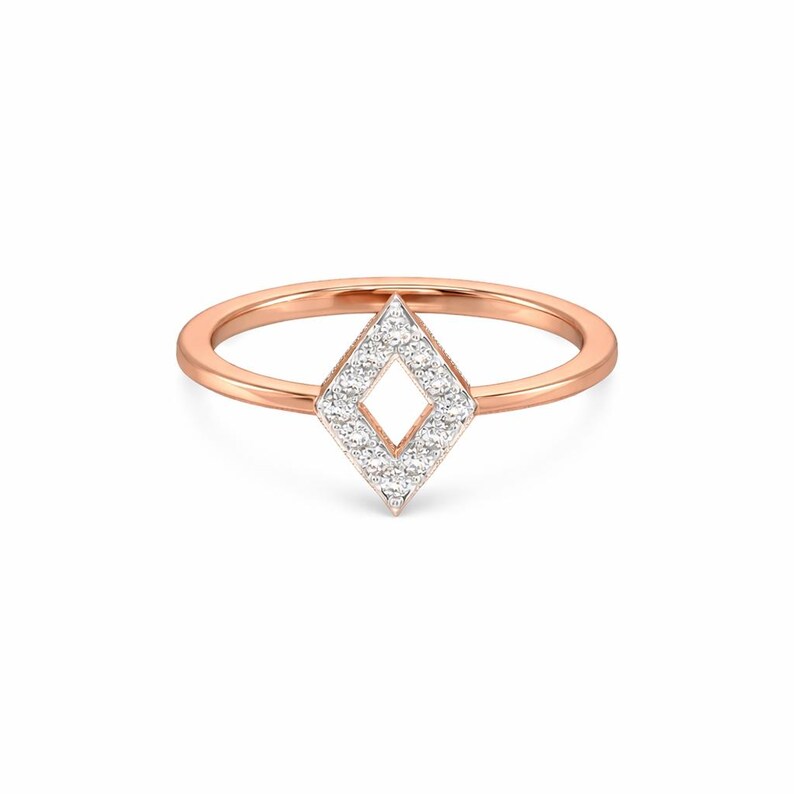 May include: Rose gold ring featuring a diamond-shaped design. The center of the ring is a diamond-shaped cluster of small, sparkling stones. The band is a thin, polished rose gold.