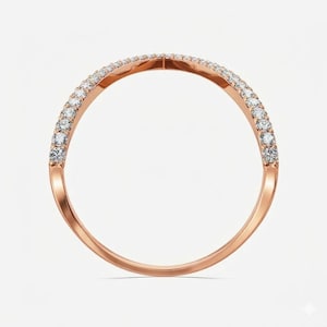 May include: Rose gold ring with a curved design, set with a row of small, sparkling white gemstones. The ring has a smooth, polished finish and a delicate, elegant appearance. The gemstones are evenly spaced along the top curve of the ring.