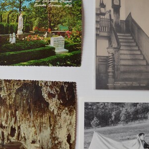 May include: A collection of vintage postcards. One postcard depicts a church and garden scene with a statue. Another shows a staircase in a historic building. A third features a cave formation, and the last shows a person with a deer.