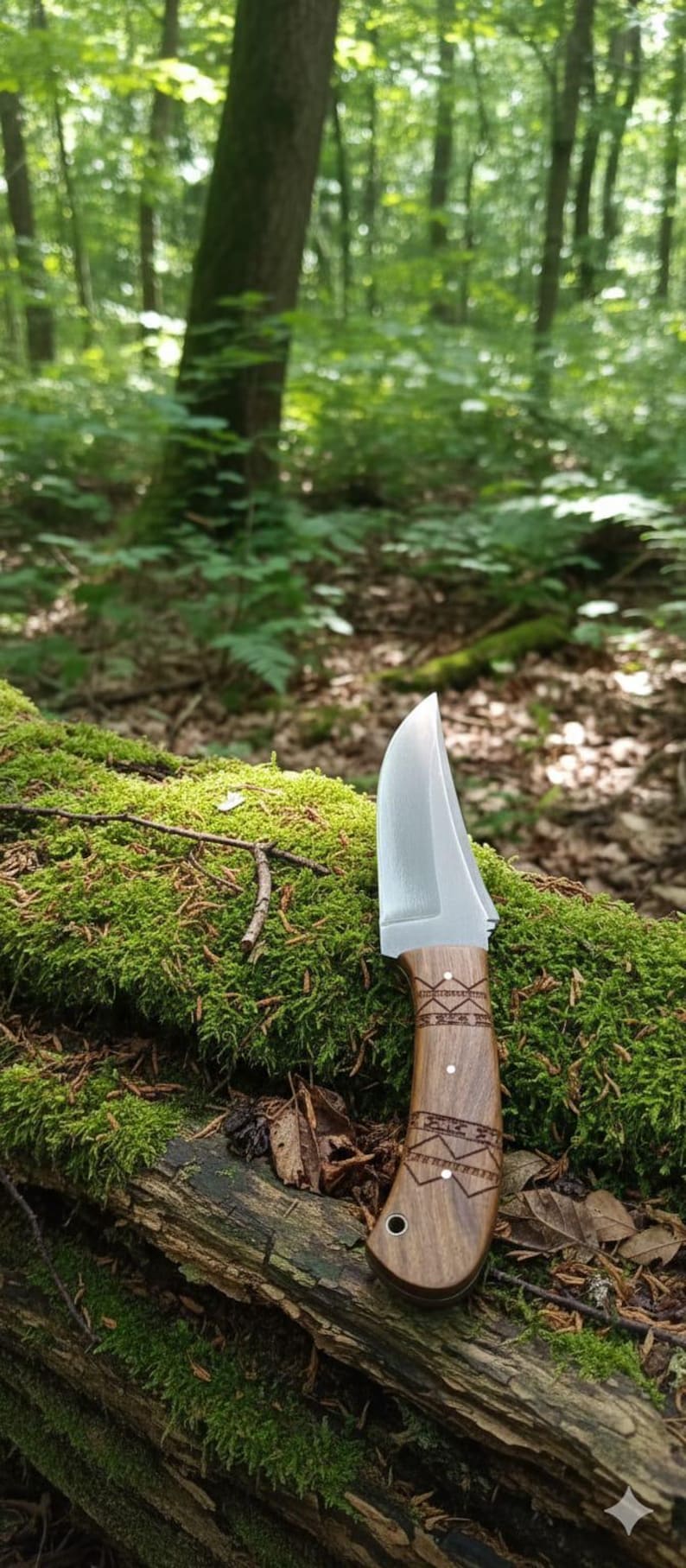 May include: A handcrafted knife with a polished blade and a wooden handle featuring decorative etchings. The knife rests on a moss-covered log in a forest setting, showcasing its outdoor utility and craftsmanship.