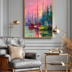 May include: A framed painting depicts a harbor scene with colorful boats and masts against a vibrant pink and purple sky. The artwork is in a gold frame, adding a touch of elegance to the coastal landscape.