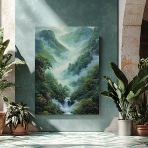 May include: A vertical canvas print showing a verdant mountain scene with a waterfall. The artwork features dense forests, misty valleys, and a cascading waterfall. The painting is displayed on a teal wall, surrounded by potted plants, creating a serene, natural ambiance.