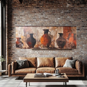 May include: A living room with a brown leather sofa, a wooden coffee table, and a painting of vases on a brick wall. The painting features several vases in shades of brown and orange. The room has a modern, rustic style.