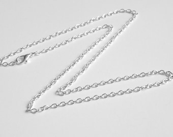 May include: A silver chain necklace with a lobster clasp.