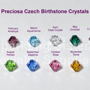 May include: A chart of Preciosa Czech Birthstone Crystals, showing a crystal for each month of the year. The crystals are arranged in two rows of six, with the month and birthstone name listed above each crystal.