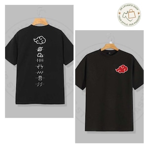 May include: Two black t-shirts with short sleeves. One has a red cloud design on the front. The other has a white cloud and symbols on the back. The shirts are displayed on wooden hangers.