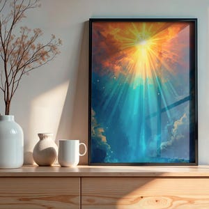 Pode incluir: Uma impressão de arte emoldurada com um design abstrato vibrante com uma explosão solar amarela brilhante irradiando luz através de um céu azul e laranja. A obra de arte é exibida em um armário de madeira, ao lado de vasos brancos e uma caneca.