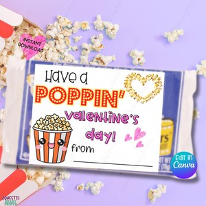 May include: A Valentine's Day popcorn treat bag with a label that reads "Have a POPPIN' Valentine's day!" in red and pink. The label features a popcorn bucket graphic and a popcorn heart. Scattered popcorn kernels surround the bag.