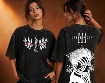 May include: A black acid-wash t-shirt featuring a graphic print. The front displays stylized eyes and Japanese characters. The back shows a character illustration with the text UPPER MOON III, featuring a figure with striped facial markings.