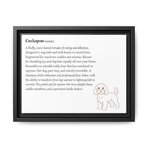 May include: Black framed canvas art featuring the word "Cockapoo" and a definition of the dog breed. The definition is written in black text with a brown line drawing of a Cockapoo dog. The canvas is rectangular.