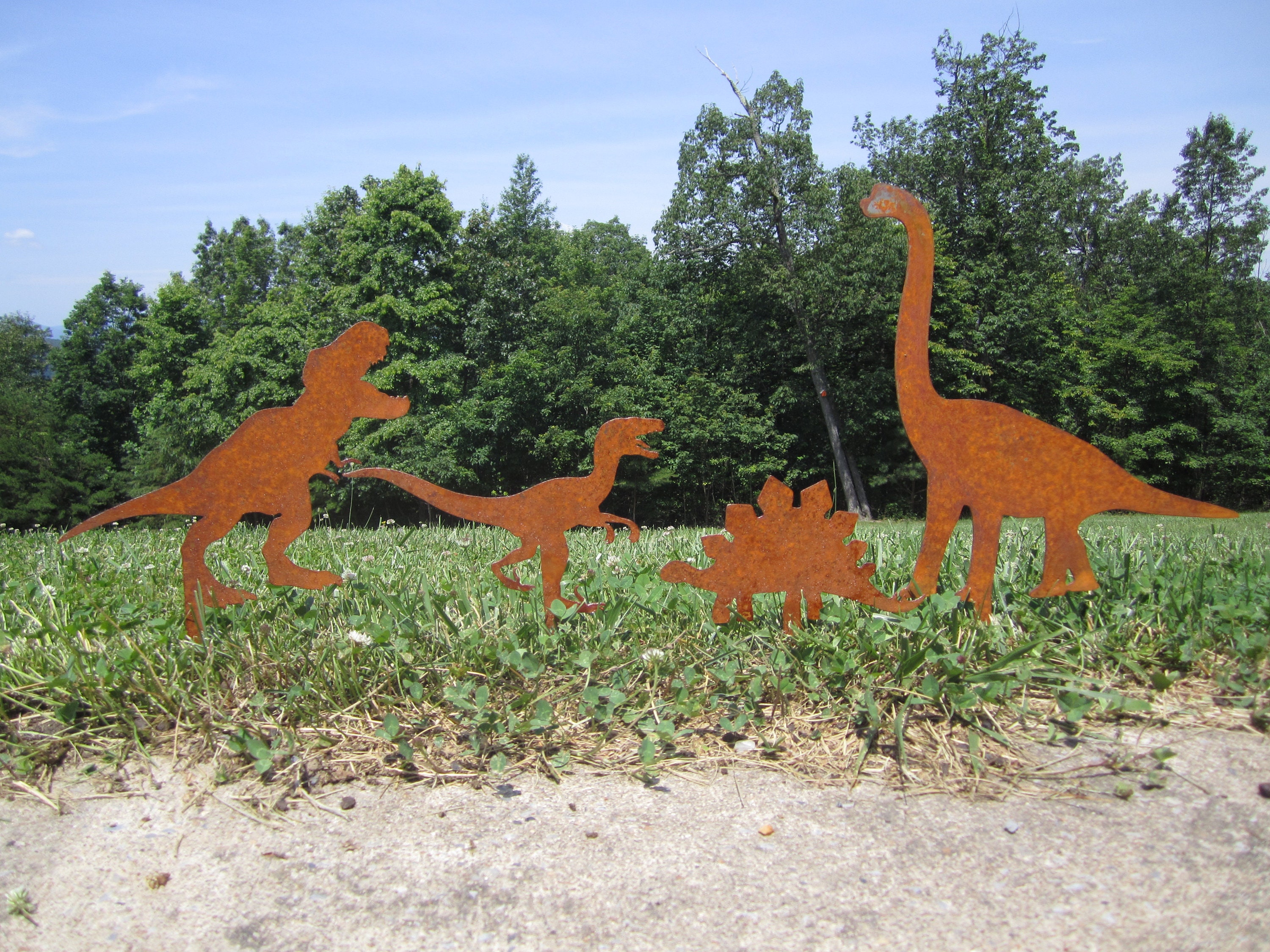 Image of Tractor with a flower planter in the shape of a dinosaur