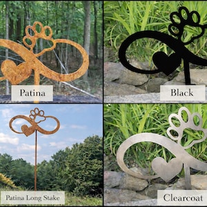 May include: Four metal garden stakes with an infinity symbol design, a heart, and a paw print. The stakes are in different finishes: Patina, Black, Patina Long Stake, and Clearcoat. Each stake has a label with its finish name.