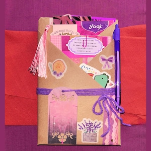 Blind Date with a Book | Blind Dates with Books Collection | Mystery Book Gift | Book Lover Gift | Bookish Gift | Reader Gift | Book Gift Box | Curated Reading Experience featuring a beautifully wrapped mystery book in brown kraft paper tied with twine, with bookmarks, bookish stickers, reading accessories, paper treasures, stationery, journaling supplies, annotation tabs, and thoughtful gifts for readers, book clubs, birthdays, holidays, Christmas, and self-care.