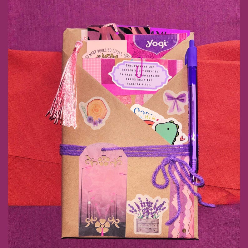 Blind Date with a Book | Blind Dates with Books Collection | Mystery Book Gift | Book Lover Gift | Bookish Gift | Reader Gift | Book Gift Box | Curated Reading Experience featuring a beautifully wrapped mystery book in brown kraft paper tied with twine, with bookmarks, bookish stickers, reading accessories, paper treasures, stationery, journaling supplies, annotation tabs, and thoughtful gifts for readers, book clubs, birthdays, holidays, Christmas, and self-care.