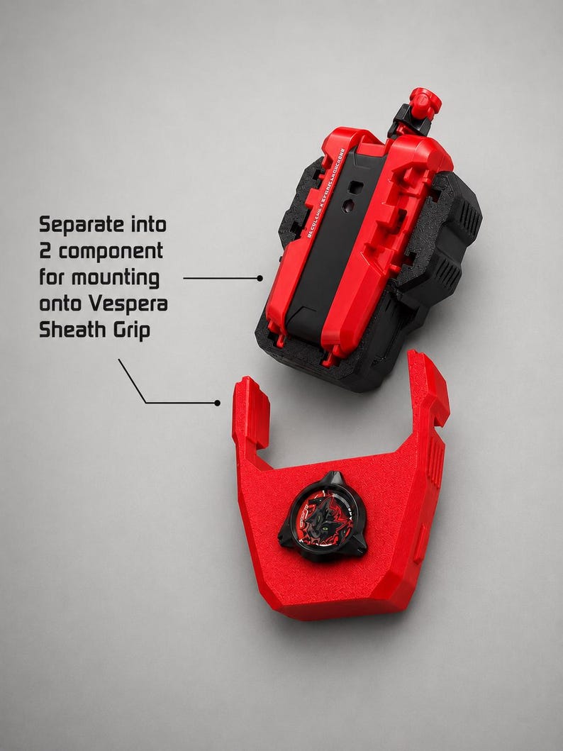 May include: A red and black mechanical component that separates into two parts for mounting onto a Vespera Sheath Grip. The top section is a textured block, while the bottom section features a circular emblem with a stylised graphic design.