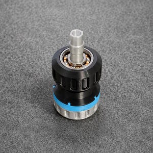 May include: A mechanical component featuring a central silver metal shaft extending from a black cylindrical housing. The assembly includes a visible ball bearing ring, a bright blue accent ring, and a silver base with vertical grooves.