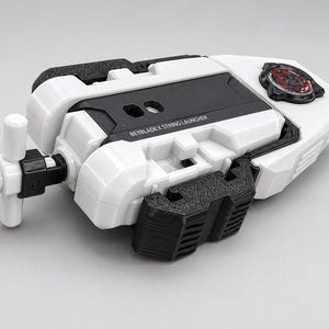 May include: A white and black Beyblade X string launcher featuring a T-shaped handle, a central black panel with the text BEYBLADE X STRING LAUNCHER, and a circular red and black emblem on the top right section of the plastic housing.