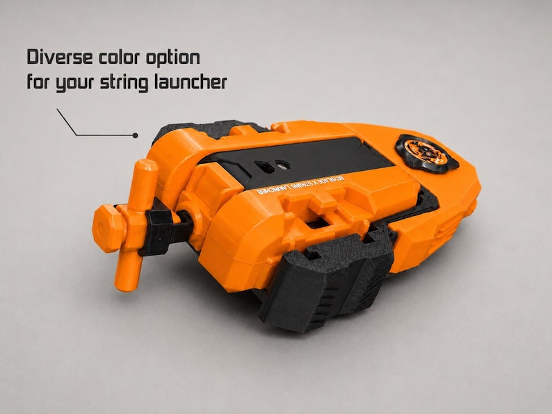 May include: An orange and black string launcher with a T-shaped handle and a circular gear mechanism. The device features the text "Diverse color option for your string launcher" and "BEYBLADE X STRING LAUNCHER" printed on the orange plastic casing.