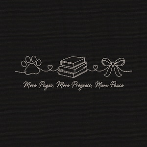 May include: A black fabric background featuring a white line art embroidery design. The design includes a paw print, a stack of three books, and a bow, connected by a continuous line with small hearts. The text reads: More Pages, More Progress, More Peace.