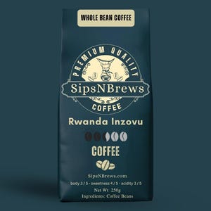 May include: A dark teal bag of whole bean coffee. The label reads "SipsNBrews Coffee Rwanda Inzovu." The bag features a logo with a coffee maker and coffee beans. The bag also lists the body, sweetness, and acidity levels, and the net weight is 250g.