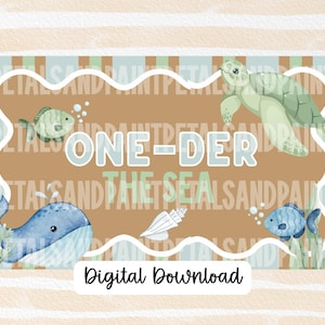 May include: A digital download featuring an aquatic theme. The design includes a whale, turtle, fish, and seashell, with the text "ONE-DER THE SEA." The background is brown with a light blue and white border. The words "Digital Download" are at the bottom.