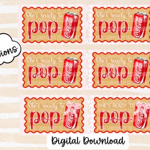 Puede incluir: Una descarga digital con seis versiones de un diseño con una lata de Coca-Cola y la frase "She's ready to pop" en escritura roja. El diseño está sobre un fondo rosa y beige con un borde decorativo. Las palabras "Descarga digital" están en la parte inferior.