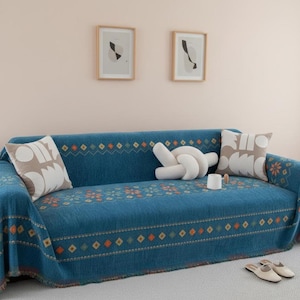 May include: A white ceramic mug with a black handle and the text "But First, Coffee" in a black, bold font. The mug is sitting on a wooden surface. The mug is approximately 4 inches tall.