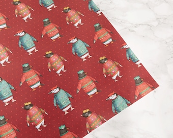 Papel de regalo para desfile de pingüinos: pájaros con sombreros Papel de regalo para pingüinos con jerséis navideños