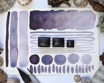Ember violet: granulating handmade watercolour paint in blackish-purple, made with vegan watercolor binder in half, quarter, or eighth pans