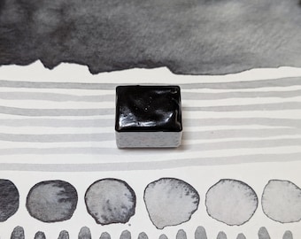 Transparent grey: a steely slightly bluish gray handmade watercolour paint, similar to Payne's grey. In 3 pan sizes. Vegan watercolor binder