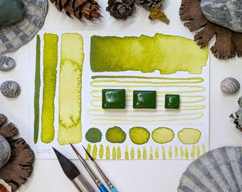 Lime: bright acid green handmade watercolour paint with strong yellow undertone, in half, quarter, eighth pans, with vegan watercolor binder