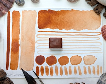 Red chalk: a unique orange-red handmade watercolour paint, made from hand-ground rock pigment and vegan watercolor binder, in half pans