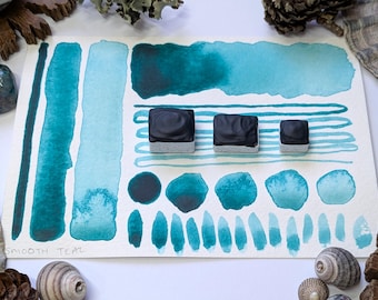 Smooth teal: blue-green handmade watercolour paint - a transparent hand-mulled watercolor in half, quarter, and eighth pans. Vegan binder.