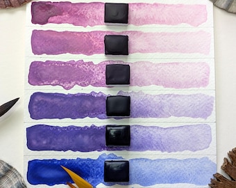 Ultramarine violets, red, & pinks: 6 shades of handmade PV15 and PR259 watercolour paint made with vegan watercolor binder, in 3 pan sizes