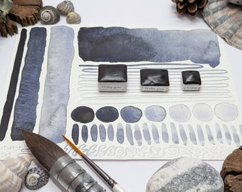 Friday grey: a cool granulating gray with complex undertones. handmade watercolour paint in 3 pan sizes. Made with vegan watercolor binder.