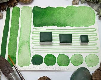 Wood-sorrel green: bright green handmade watercolour paint with subtle granulation. Comes in 3 pan sizes. Made with vegan watercolor binder