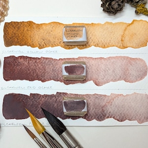 Clearwell Caves ochres: handmade watercolour paint in purple, red, brown, yellow ochre. 3 pan sizes, vegan binder