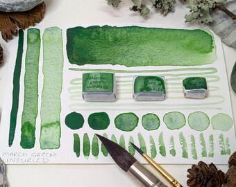 March green - unfurled: lightly granulating green handmade watercolour paint. Hand-mulled watercolor in half, quarter, & eighth pans. Vegan