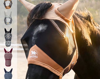 May include: A tan horse fly mask with mesh ear covers and a black mesh eye shield. The mask features a tan fabric nose panel with the white text Barn & Stable and a circular horse logo. The design includes soft tan trim along the edges.