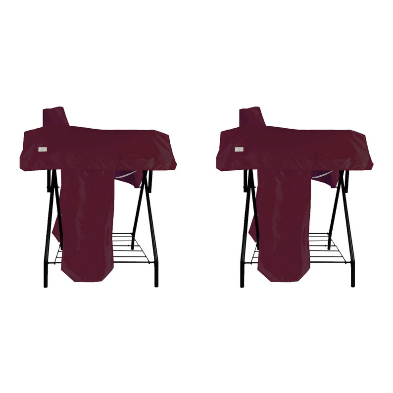 May include: Two identical dark maroon grill covers draped over black metal stands. Each cover features a rectangular white label on the front left side. The stands have a simple four-legged frame with a lower wire rack shelf for storage.